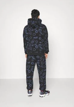 Presa 😉 KARL KANI X SMILEY® SIGNATURE REGULAR FIT UNISEX - Pantaloni Sportivi - Black 🌟 -Sconto Karl Kani in Italia 08ddb4089d824c799947faa31e2695c6