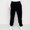 Buono ⭐ Karl Kani SMALL SIGNATURE PANTS UNISEX - Pantaloni Sportivi - Black 👏
