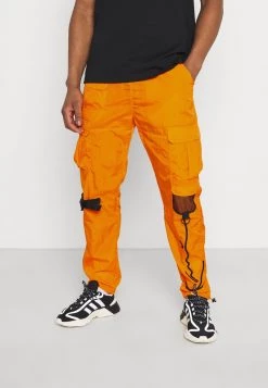 Nuovo di zecca ✔️ Karl Kani SIGNATURE CRINCLE PANTS UNISEX - Pantaloni Cargo - Orange 👏