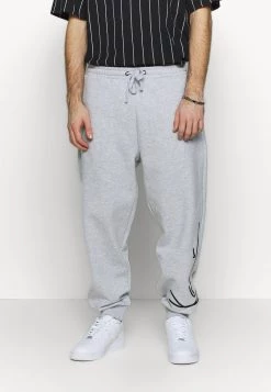 I primi 10 🤩 Karl Kani SIGNATURE RETRO - Pantaloni Sportivi - Grey/black, Uomo 🤩