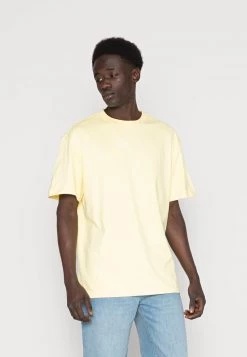 Miglior prezzo 🔔 Karl Kani SMALL SIGNATURE ESSENTIAL TEE UNISEX - T-shirt Basic - Light Yellow 😉