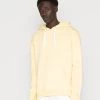 Miglior prezzo 🔥 Karl Kani SMALL SIGNATURE ESSENTIAL HOODIE UNISEX - Felpa Con Cappuccio - Light Yellow 🛒 -Sconto Karl Kani in Italia e90fe468324a4d0db3b4dafb4f0a0eda